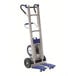 A powered stair climbing hand truck with a metal frame, large wheels, and a blue platform for transporting heavy loads.