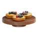 A group of fruit tarts on a Cal-Mil round walnut cake pedestal.