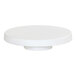 A white round Cal-Mil cake pedestal.