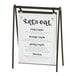 A Cal-Mil Onyx powder-coated metal hanging card holder with a menu sign in it.