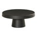 A black round Cal-Mil cake pedestal.