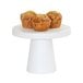 A white Cal-Mil melamine cake pedestal with muffins on it.