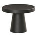 A black round Cal-Mil cake pedestal on a black table.