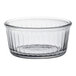 A clear glass Duralex ramekin with a rim.