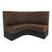 A brown and black curved cafe booth with black legs.