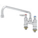 A chrome T&S deck-mounted faucet with two lever handles.