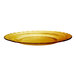 A close up of a yellow Duralex Picardie glass dessert plate with a scalloped edge.