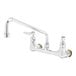 A chrome T&S wall mount pantry faucet with two silver handles and a 12" swing nozzle.
