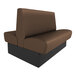 A brown and black booth with brown leather seats and black legs.