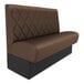 A brown leather booth seat with black trim.