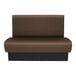 A brown and black bench with a metal base.