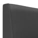 A close up of a black leather headboard on a QA Group Cascade 1/2 Circle Booth.