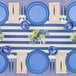 A table set with Sophistiplate Simply Eco French Blue salad plates and silverware.