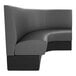 A graphite plain curved corner booth with black and grey upholstery.