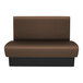A brown rectangular booth with a black base.