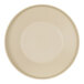 A taupe plate with a round rim on a white surface.