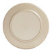A taupe plate with a round edge and a white rim.