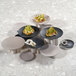 A group of Cal-Mil black round coupe melamine plates with food on them.