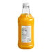 A yellow bottle of Monin Brilliance Starfruit Energy Concentrate with a label.