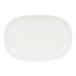 A white Cal-Mil oval melamine plate with a raised rim.