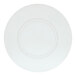 A close up of a white Cal-Mil round melamine plate with a circular design.