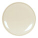 A brown and cream round melamine plate with a white surface and light shining on it.