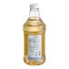 A Monin Brilliance Glacier Clear Energy Concentrate bottle with a white label and cap.