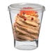 A close-up of a dessert in a clear Solia plastic cup with cranberries.