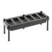 An American Metalcraft black plastic tray with four compartments and holes.