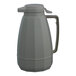 A gray plastic Service Ideas coffee carafe with a handle.