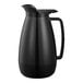 A black plastic coffee carafe with a black handle.