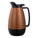 A brown and black Service Ideas Thermo-Serv coffee carafe with a flip-top lid.