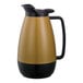 A black and gold Service Ideas Thermo-Serv coffee carafe with a flip-top lid and handle.