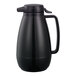 A black Service Ideas plastic coffee carafe with a handle and push-button lid.