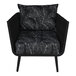 A black outdoor armchair with black rope and black Sunbrella cushions and back pillow.