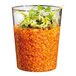 A Solia clear plastic cup filled with food.