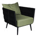 A BFM Seating black outdoor armchair with green Sunbrella cushions and back pillow.