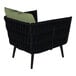 A black wicker BFM Seating outdoor armchair with green Sunbrella cushions and back pillow.