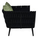 A black BFM Seating outdoor armchair with a green Sunbrella cushion and back pillow.