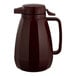 A brown plastic Service Ideas coffee carafe with a lid and handle.