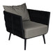 A black BFM Seating outdoor armchair with a Sunbrella charcoal cushion and back pillow.