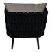 A BFM Seating black wicker outdoor armchair with a Sunbrella charcoal cushion and back pillow.