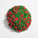 A round pile of red and green holiday sprinkles.