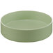 A close up of a green Cal-Mil Melamine bowl with a raised rim.