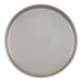 A close-up of a white Cal-Mil melamine plate with a raised rim and a circle.