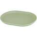 A white oval Cal-Mil melamine platter with a raised rim.