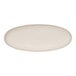 A white oval platter with a curved edge and white border.