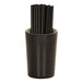 A Cal-Mil ivory and black two-tone cylinder with black straws in it.
