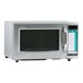 A silver Sharp commercial microwave with a black screen.
