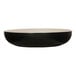A black and ivory round bowl with a black interior.